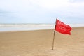 Red flag Warning Strong Current and Dangerous No Swimming in sea on Storm. Red flag flying on beach Royalty Free Stock Photo