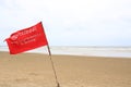 Red flag Warning Strong Current and Dangerous No Swimming in sea on Storm. Red flag flying on beach Royalty Free Stock Photo