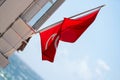 Red flags on the beach dangerous no swimming warning Royalty Free Stock Photo