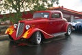 Red Flamed Hotrod in rain Royalty Free Stock Photo