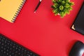 Red Flat Lay Desk with Pen, Keyboard, Mouse, Planner and Potted Plant Royalty Free Stock Photo