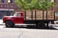 Red Flatbed Ford on The Corner, Taking It Easy. Eagles Iconic Location. Winslow, Arizona, USA. June 12, 2014.