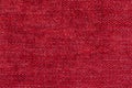 red fleecy background. shaggy fiber surface. fine grain felt red fabric. texture polyester close-up