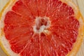 Red flesh of grapefruit close-up. Half of grapefruit, fresh citrus. Texture. Sour ripe juicy fruit Royalty Free Stock Photo