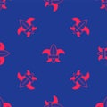 Red Fleur de lys or lily flower icon isolated seamless pattern on blue background. Vector Royalty Free Stock Photo