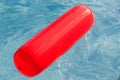 Red float floating in the pool Royalty Free Stock Photo