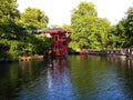 A red floating Chinese restaurant Feng Shang Princess hidden by the side of the Regent`s Canal in Camden
