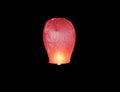 Red floating sky lantern Royalty Free Stock Photo