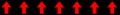 Red flow direction tape on black background. A long horizontal black decorative stripe with multiple red arrows in row