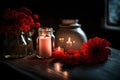 Red flower jar with a candle on the table