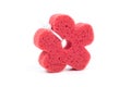 Red flower shaped bath sponge isolated on white background, surface. Bathing sponge. Royalty Free Stock Photo