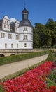 Red flowers in front of the Neuhaus castle in Paderborn Royalty Free Stock Photo