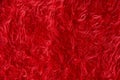 Red fluffy cloth texture. Close up of plush burgundy sweater. Chirstmas background Royalty Free Stock Photo