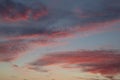 Red fluffy sunset clouds over blue sky Royalty Free Stock Photo