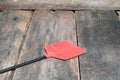 Red fly swatter. Single flyswatter made of plastic