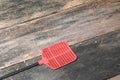 Red fly swatter. Single flyswatter made of plastic and unfailing