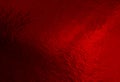 Red foil background with uneven texture Royalty Free Stock Photo