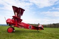 Red Fokker Dr.I Dreidecker triplane stands on airport Royalty Free Stock Photo