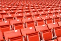 Red folding chairs lined on the stadium sport