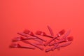 Red Forks and Knives on Bright Orange Background, Single Use Cutlery Royalty Free Stock Photo