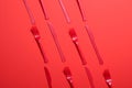 Red Forks and Knives on Bright Orange Background, Single Use Cutlery Royalty Free Stock Photo