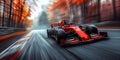 red formula one racing car driving fast on the race track in nature at autumn. Motion blur Royalty Free Stock Photo