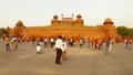 red fort with tricolour square in front with numerous Indian tourists