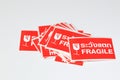 red Fragile stickers for stick on a parcel with thai language mean \