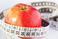 Red fresh apple and measure tape. diet concept Royalty Free Stock Photo