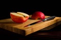 Red fresh apples, chopped up on the old board Royalty Free Stock Photo