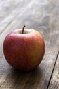 Red fresh organic apple on old wooden table Royalty Free Stock Photo
