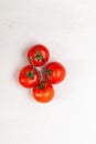 Red  fresh organic tomatoes bunch on a white background Royalty Free Stock Photo