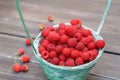 Red fresh raspberries basket on brown rustic wood background Royalty Free Stock Photo