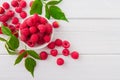 Red fresh raspberries on white rustic wood background Royalty Free Stock Photo