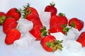 Red fresh ripe Strawberry with ice cubes scattered on a white background