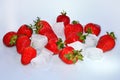 Red fresh ripe Strawberry with ice cubes scattered on a white background