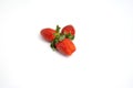 Red and fresh strawberries isolated on white Royalty Free Stock Photo