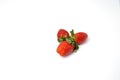Red and fresh strawberries isolated on white Royalty Free Stock Photo