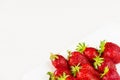 Red fresh strawberries in a white dish isolated on white background. Close up view. Royalty Free Stock Photo
