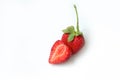 Red fresh strawberry with sliced half and leaves isolated on white background. Copy space. Top view. Strawberries background. Food Royalty Free Stock Photo