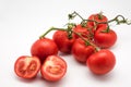 Red and fresh tomatoes on the vine isolated on white Royalty Free Stock Photo