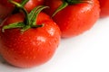 Red fresh tomatoes on white background