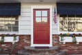 Red front door of an american home