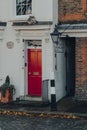 Red front door of a traditional English terraced house in Cardinals wharf, London, UK Royalty Free Stock Photo