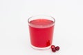 Red fruit drink from cranberries in a glass glass on a white background Royalty Free Stock Photo
