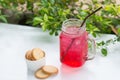 Red fruit flavor soft drink with biscuits.