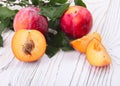 Red fruit plum with green leaves