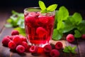 Red fruit tea with raspberry and mint. Glass of cold raspberry tea. Generative AI