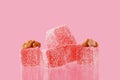 Red fruit Turkish delight on a pink background. Royalty Free Stock Photo