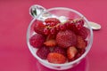 Red fruits in bowl glass